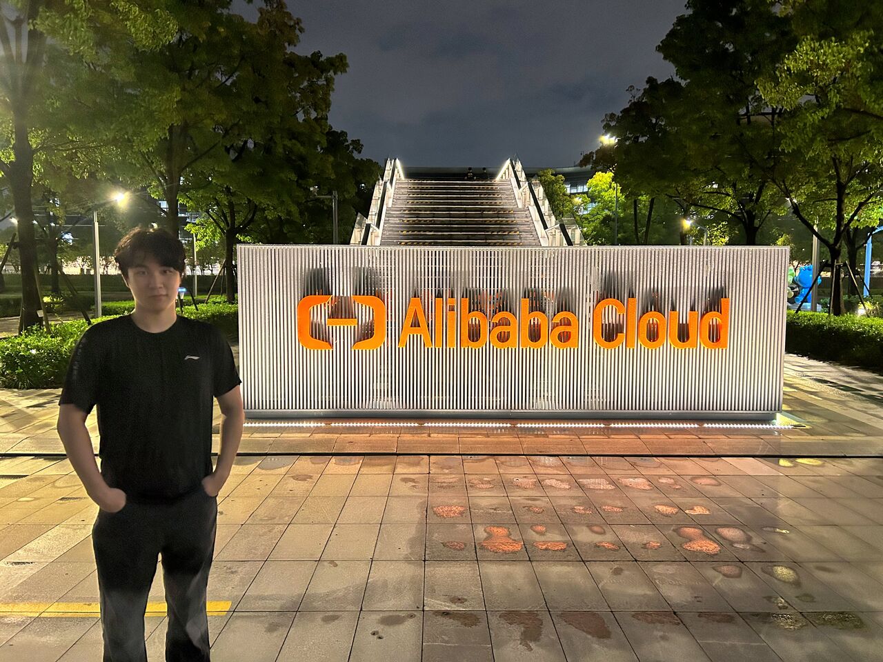With the Alibaba Cloud logo on the last evening of the internship